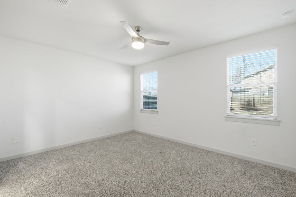 10912 Fulton Avenue Austin, TX 78754 - Photo 4 of 15 an empty room with a window