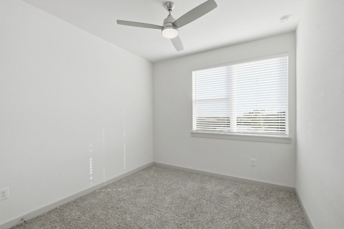 10912 Fulton Avenue Austin, TX 78754 - Photo 7 of 15 an empty room with a window