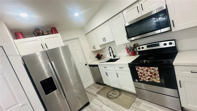 a bathroom with a toilet sink and vanity