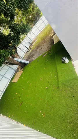 a view of a swimming pool with an outdoor seating and a bench