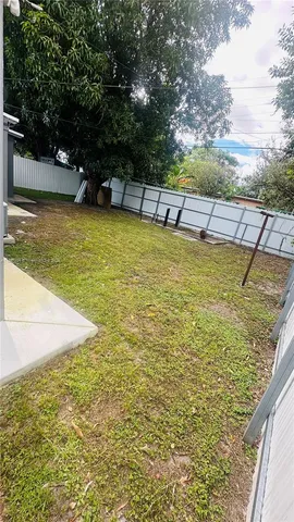 a bedroom with bed and wooden floor