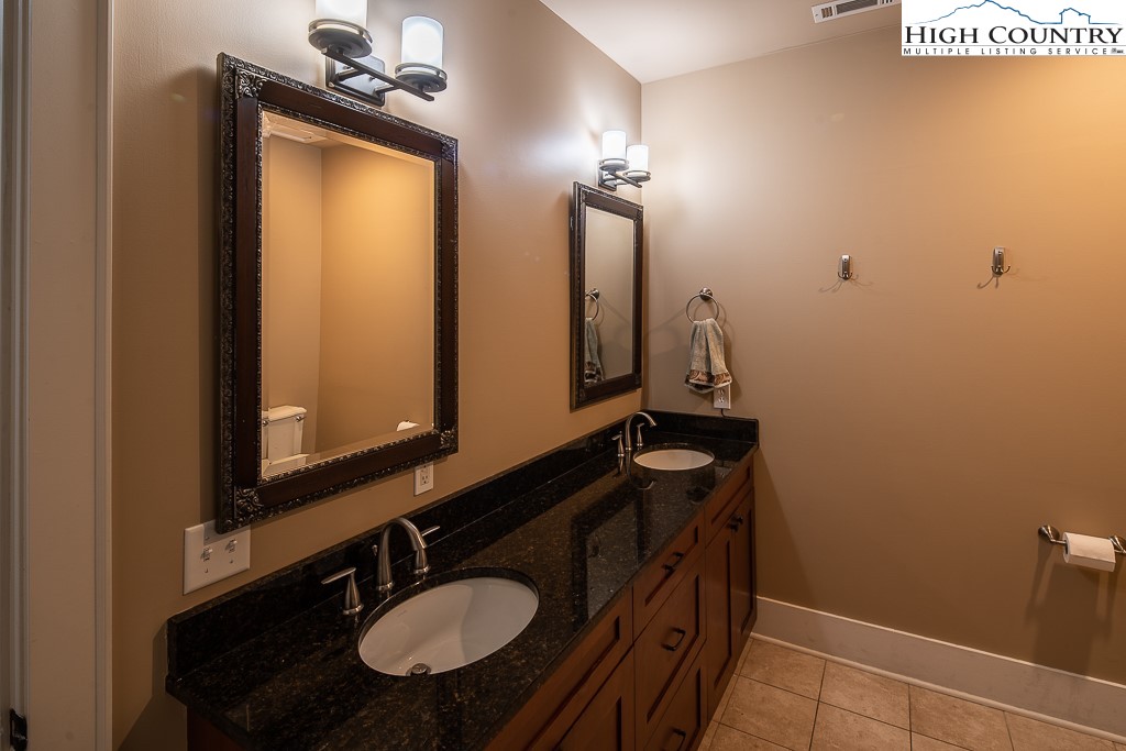 148 Highway 105 Extension, Unit 203 Boone, NC 28607 - Photo 11 of 25 a bathroom with a sink and a mirror