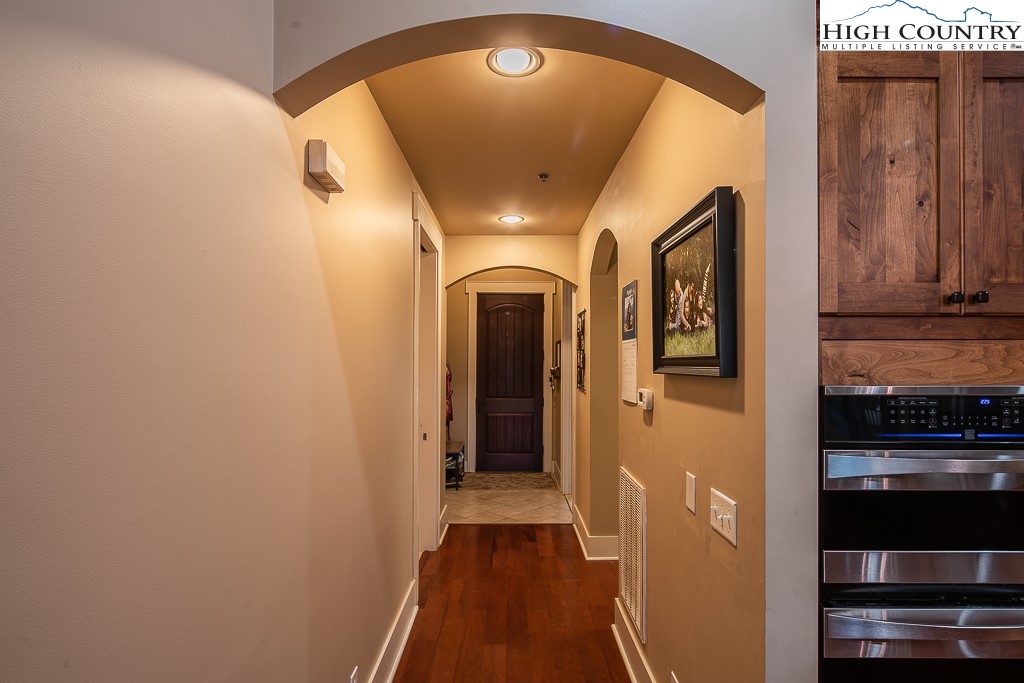 148 Highway 105 Extension, Unit 203 Boone, NC 28607 - Photo 14 of 25 a view of a hallway with wooden floor