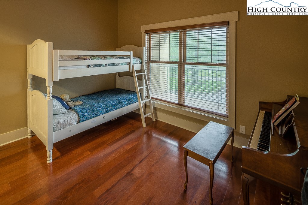 148 Highway 105 Extension, Unit 203 Boone, NC 28607 - Photo 15 of 25 a bedroom with a bed and a window
