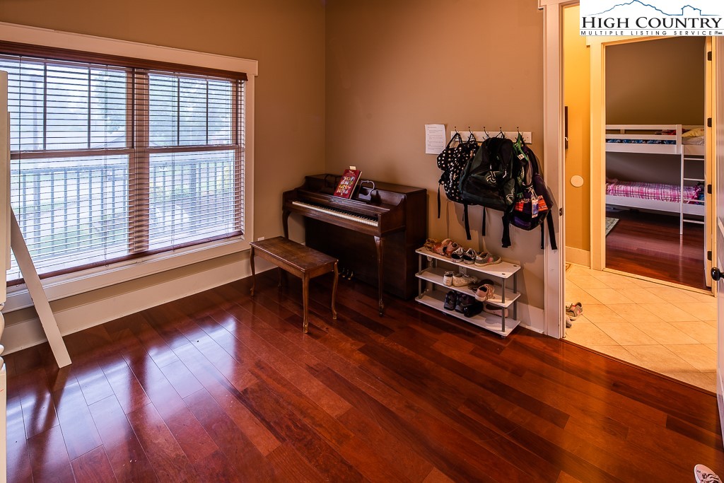 148 Highway 105 Extension, Unit 203 Boone, NC 28607 - Photo 16 of 25 a view of a room with wooden floor air conditioner and windows