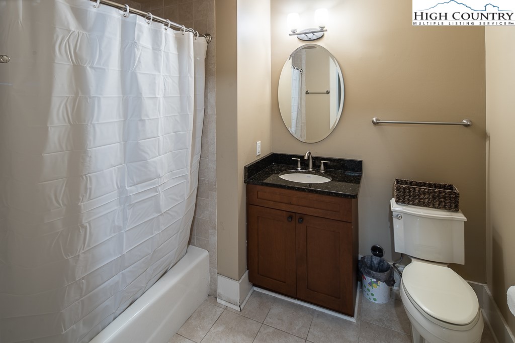 148 Highway 105 Extension, Unit 203 Boone, NC 28607 - Photo 22 of 25 a bathroom with a sink toilet and shower