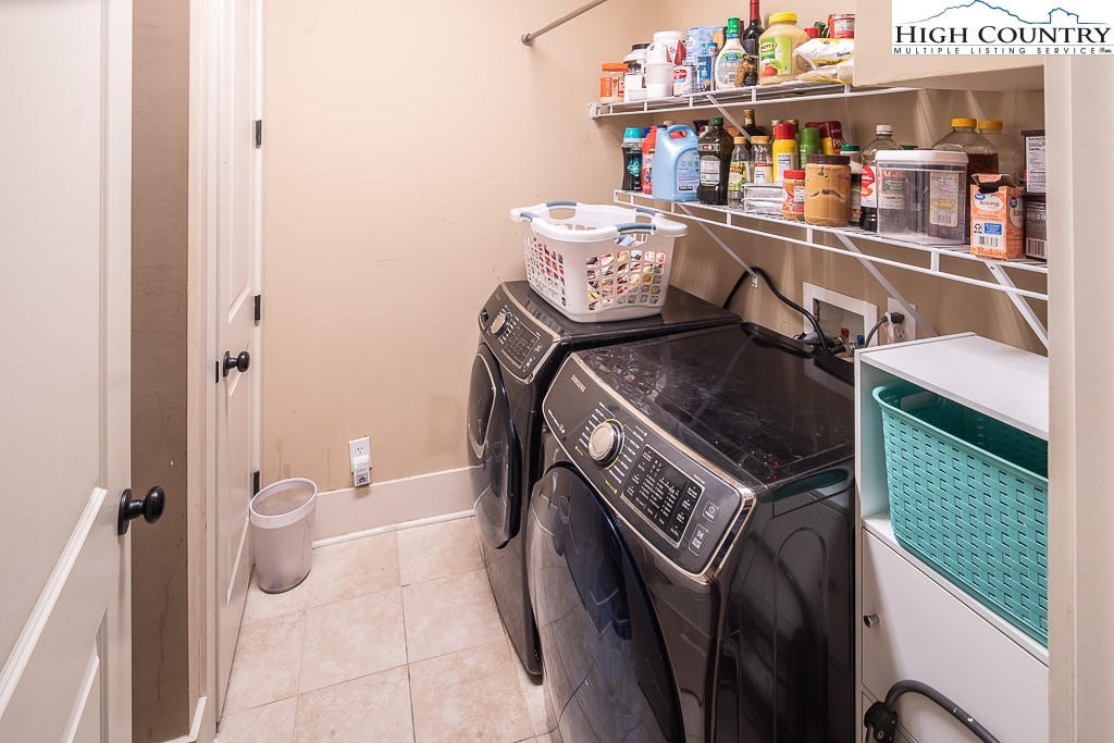 148 Highway 105 Extension, Unit 203 Boone, NC 28607 - Photo 23 of 25 a utility room with dryer and washer