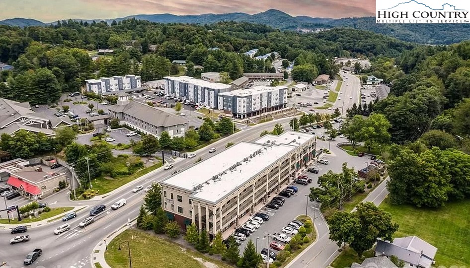 148 Highway 105 Extension, Unit 203 Boone, NC 28607 - Photo 24 of 25 a view of a balcony with an outdoor seating