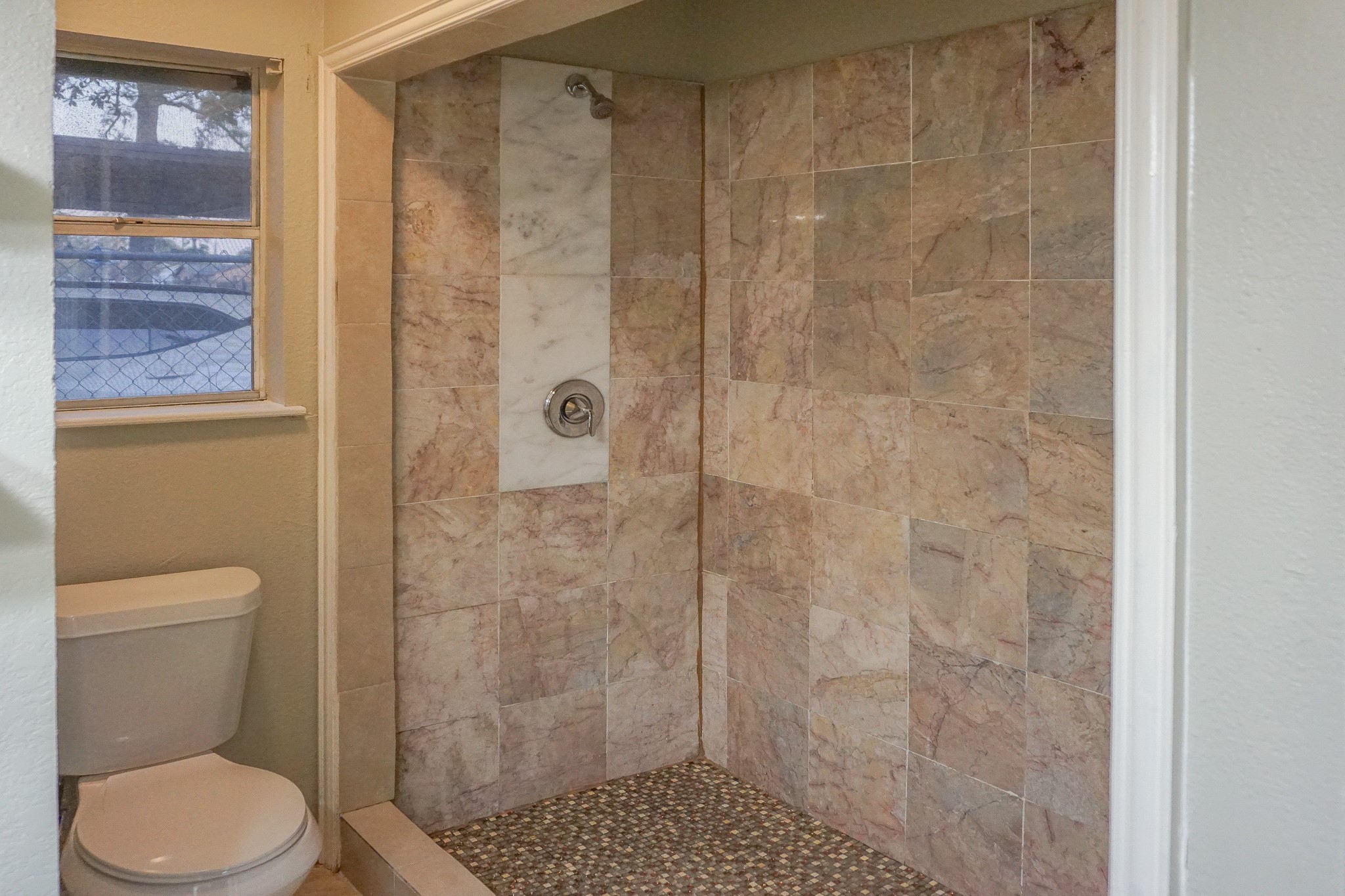 8521 Woodlyn Road Houston, TX 77028 - Photo 16 of 26 Walk in shower in primary bathroom