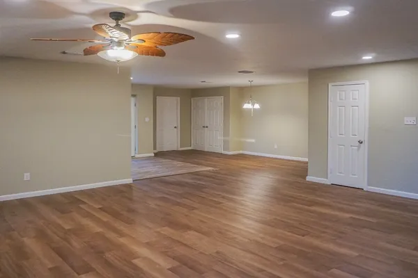 a kitchen with white cabinets and appliances