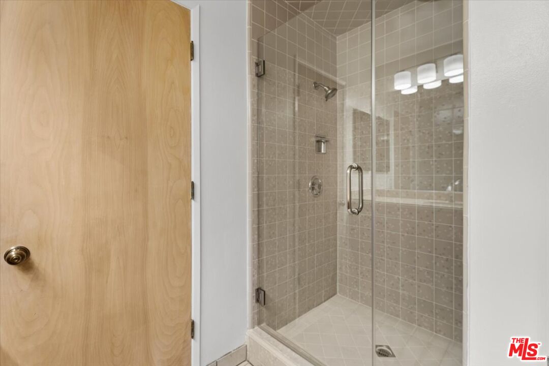 13521 Bayliss Road Los Angeles, CA 90049 - Photo 27 of 46 a bathroom with a shower and a sink