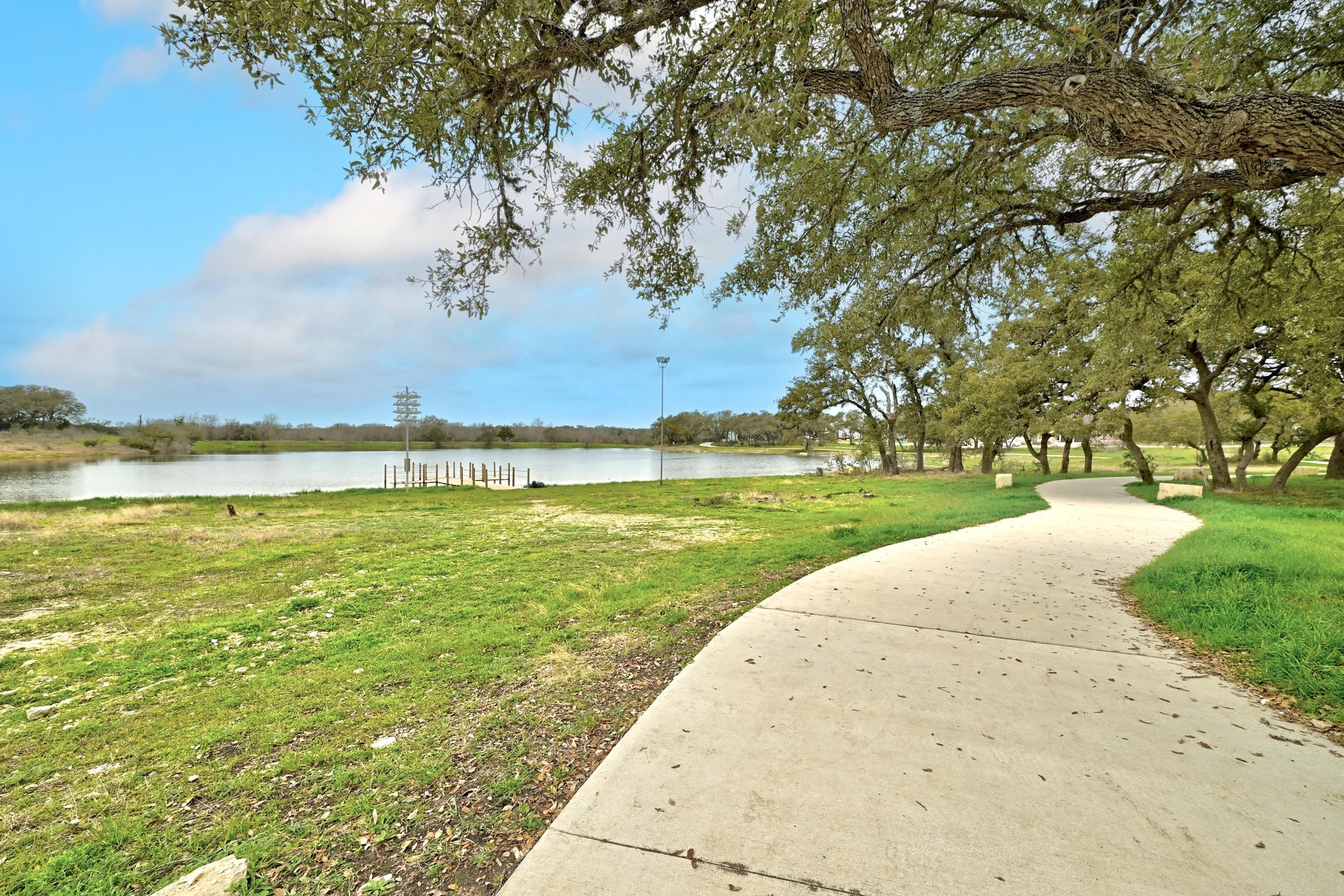 208 West Branch Road Kyle, TX 78640 - Photo 24 of 27 Residents will enjoy a catch-and-release fishing pond and trails for staying active.