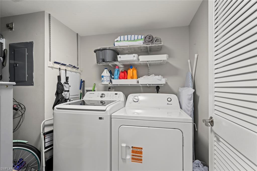 5965 Bloomfield Circle, Unit B104 Naples, FL 34112 - Photo 16 of 39 a utility room with dryer and washer