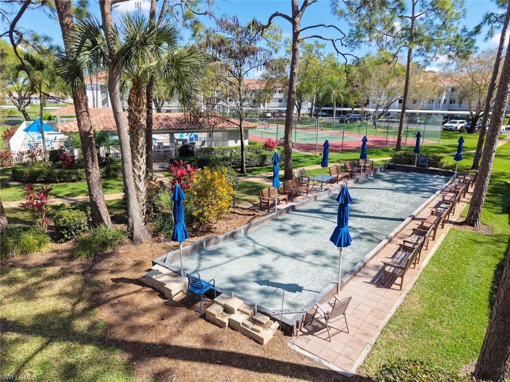 5965 Bloomfield Circle, Unit B104 Naples, FL 34112 - Photo 20 of 39 a view of a park with swings