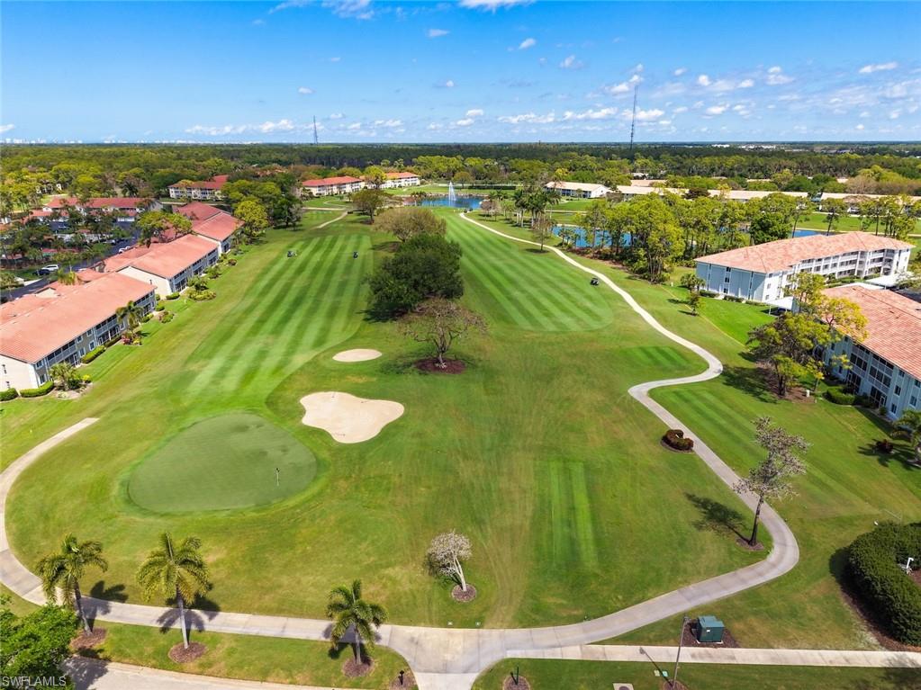 5965 Bloomfield Circle, Unit B104 Naples, FL 34112 - Photo 23 of 39 a view of an ocean from a balcony
