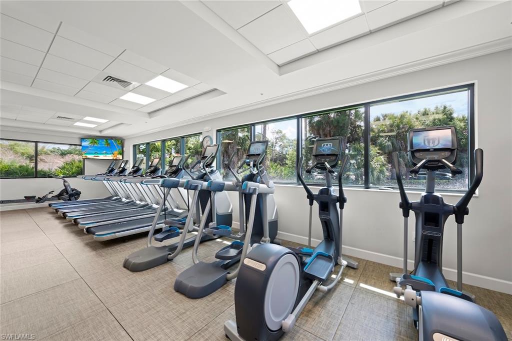 5965 Bloomfield Circle, Unit B104 Naples, FL 34112 - Photo 34 of 39 a view of a room with gym equipment