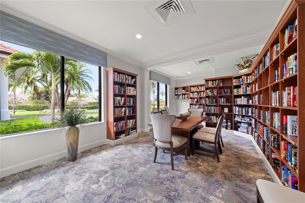 5965 Bloomfield Circle, Unit B104 Naples, FL 34112 - Photo 38 of 39 a reading room with furniture and a book shelf