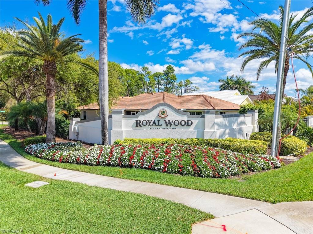 5965 Bloomfield Circle, Unit B104 Naples, FL 34112 - Photo 39 of 39 a view of a house with a yard and potted plants