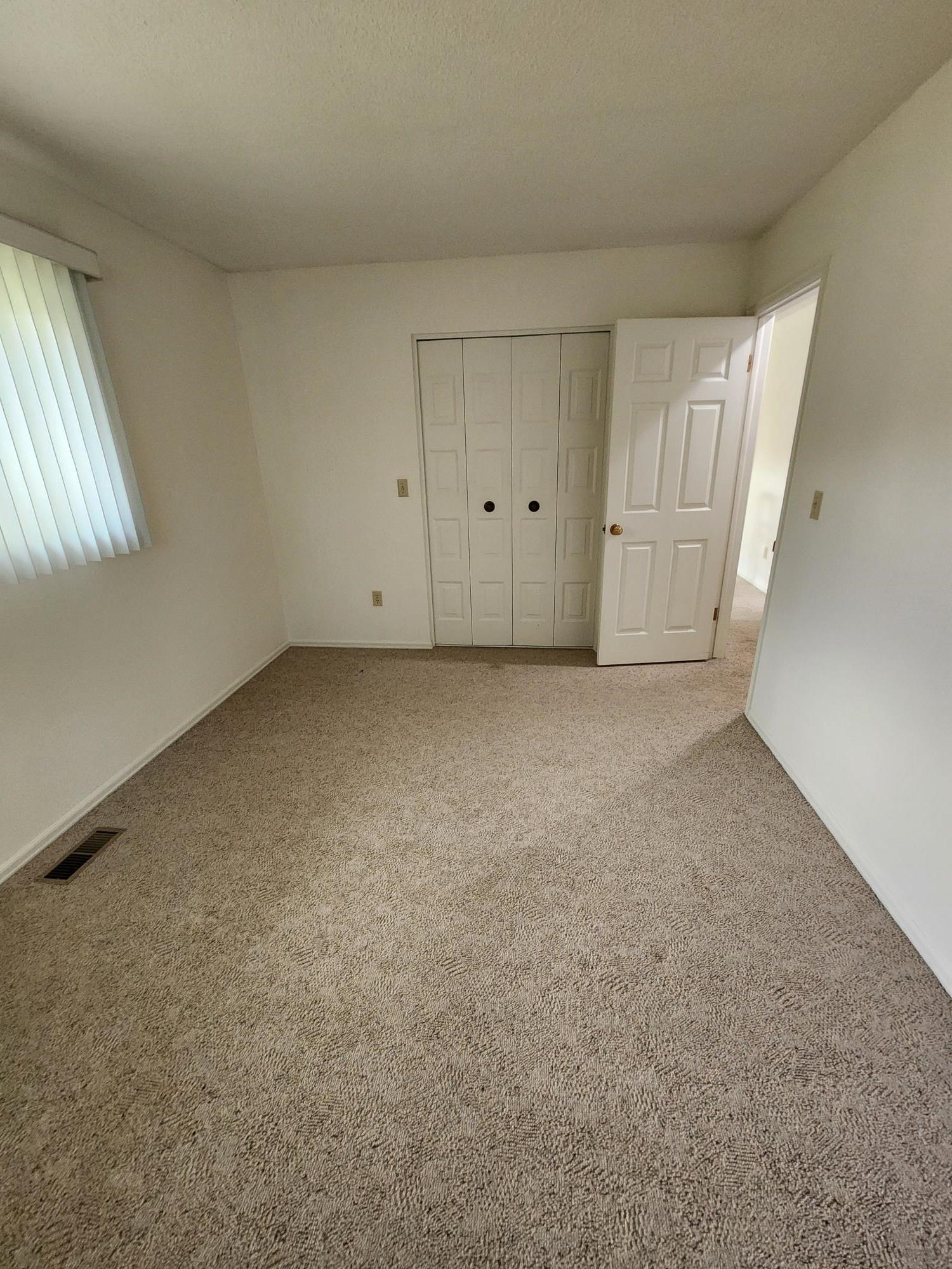 2700 G Road, Unit 7B Grand Junction, CO 81506 - Photo 20 of 31 a view of an empty room with a window