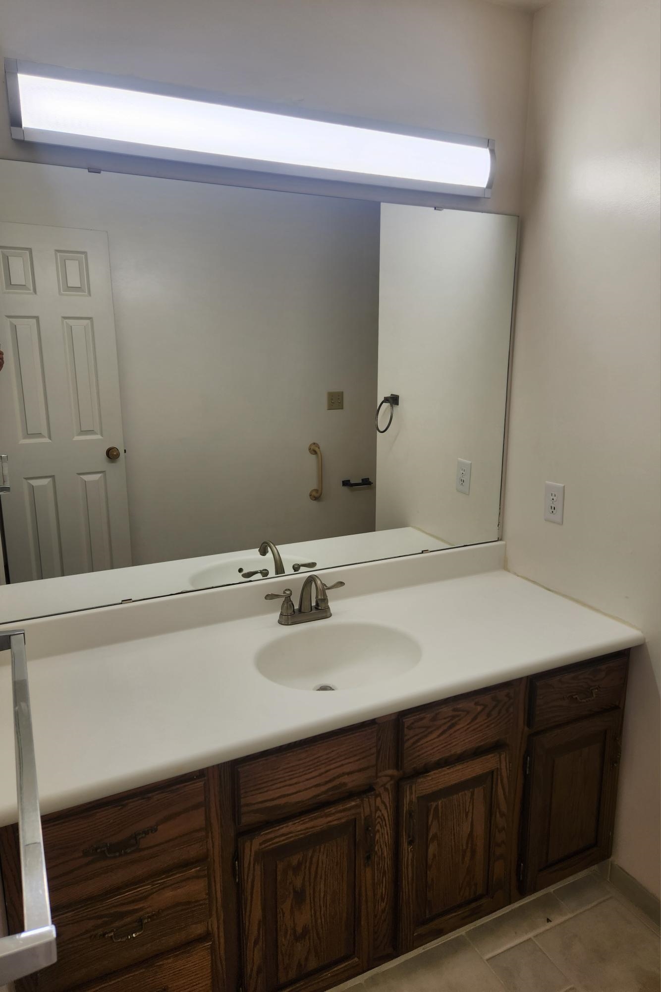 2700 G Road, Unit 7B Grand Junction, CO 81506 - Photo 22 of 31 a bathroom with a sink vanity granite and a mirror