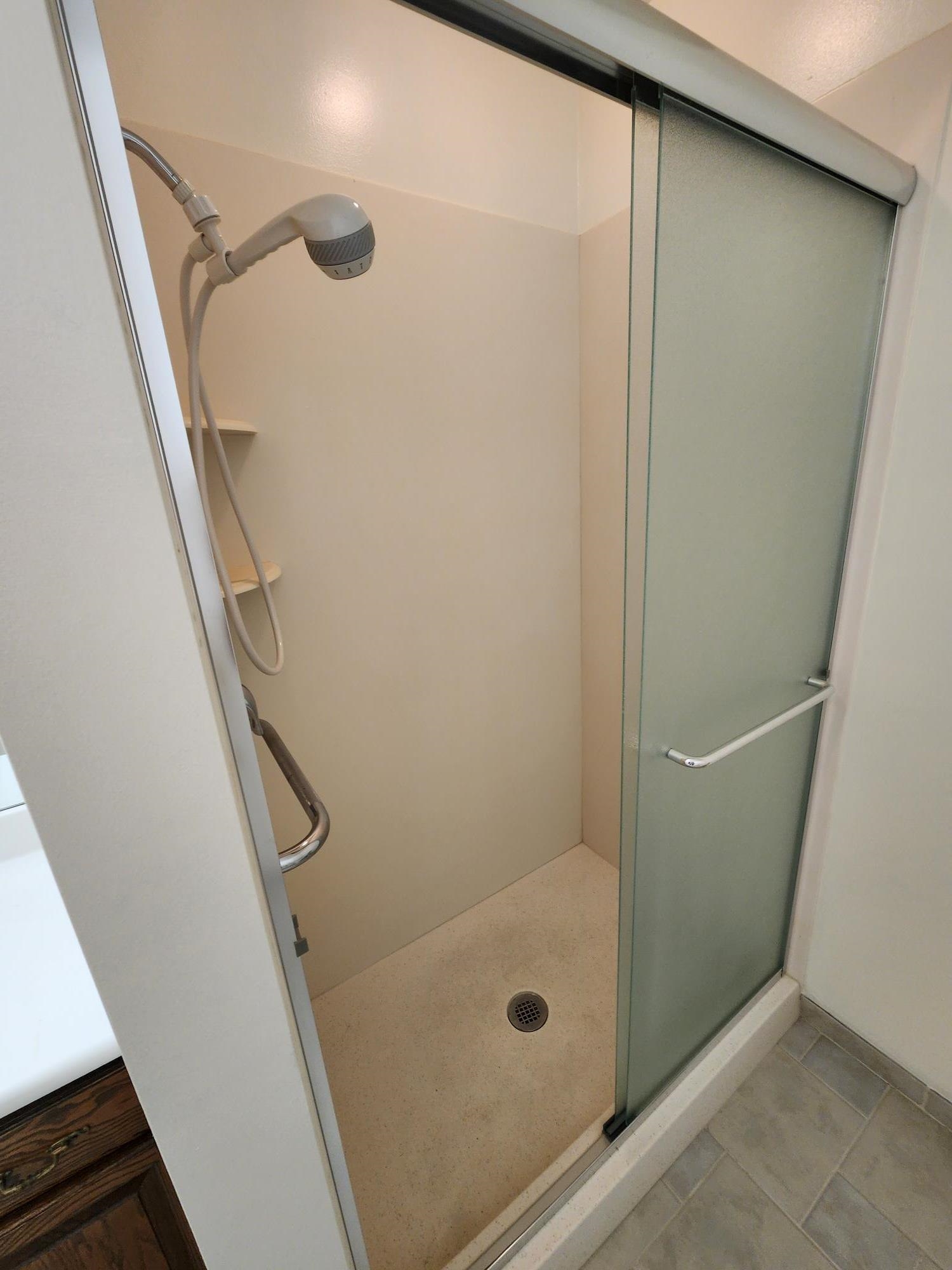 2700 G Road, Unit 7B Grand Junction, CO 81506 - Photo 24 of 31 a bathroom with a glass door shower and a sink