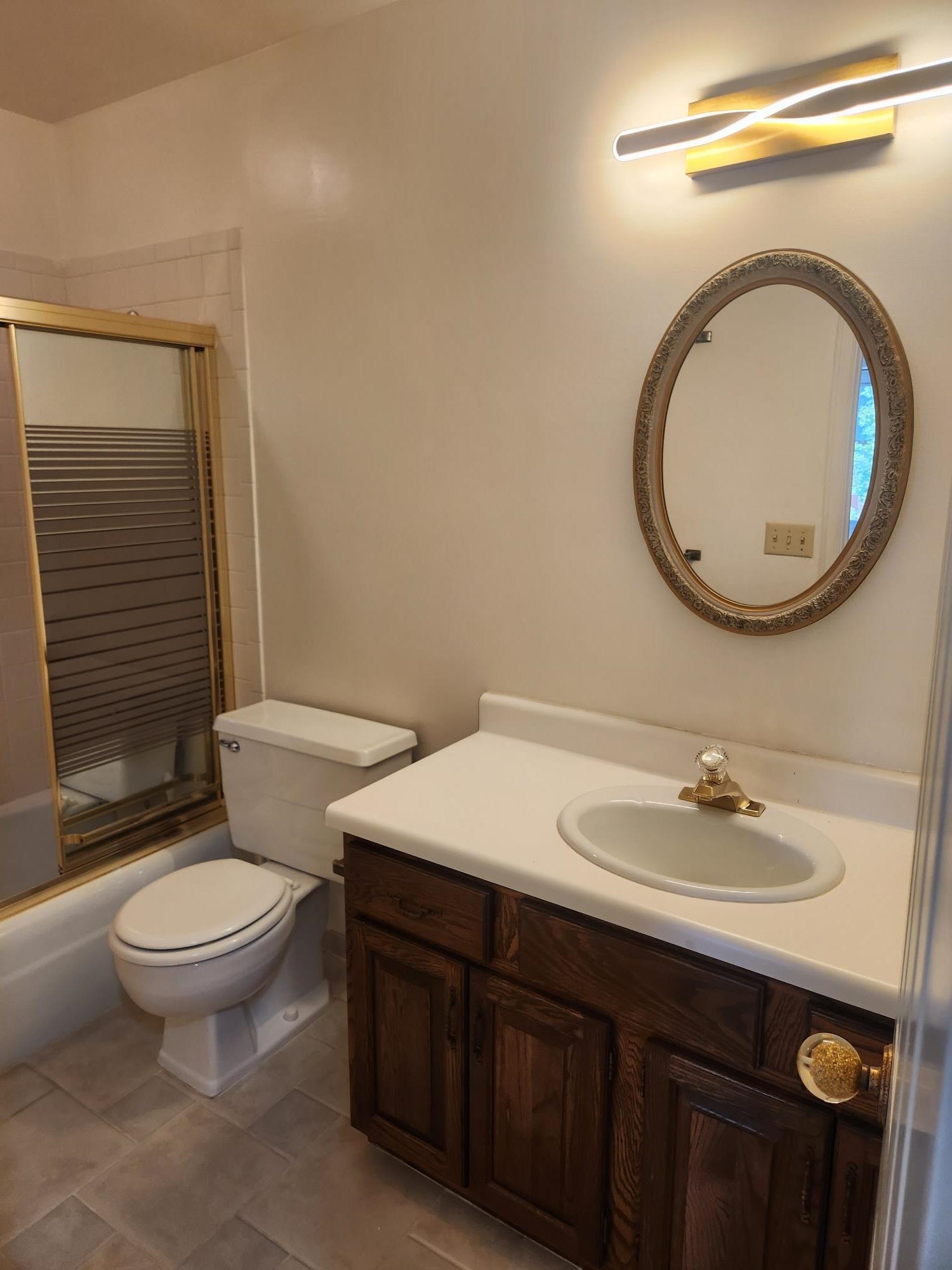 2700 G Road, Unit 7B Grand Junction, CO 81506 - Photo 25 of 31 a bathroom with a toilet a sink and mirror