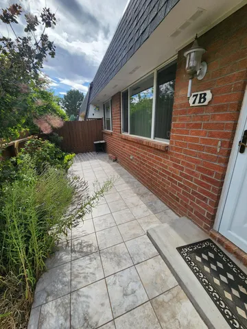 a view of backyard with seating space