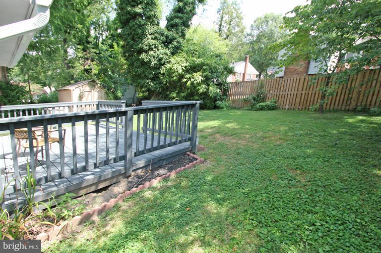 10209 Procter Street Silver Spring, MD 20901 - Photo 11 of 23 a view of a deck with a small yard