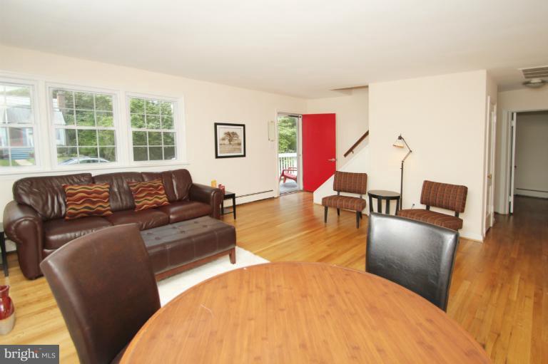 10209 Procter Street Silver Spring, MD 20901 - Photo 13 of 23 a living room with furniture and a large window