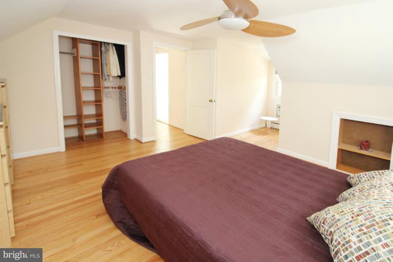 10209 Procter Street Silver Spring, MD 20901 - Photo 20 of 23 a bedroom with a bed and a flat screen tv