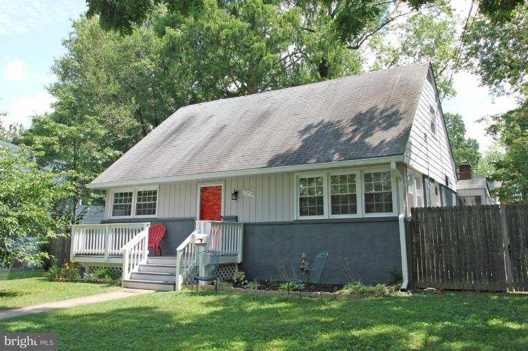 10209 Procter Street Silver Spring, MD 20901 - Photo 23 of 23 a view of backyard with table and chairs and wooden fence