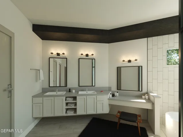 a bathroom with double vanity and a mirror