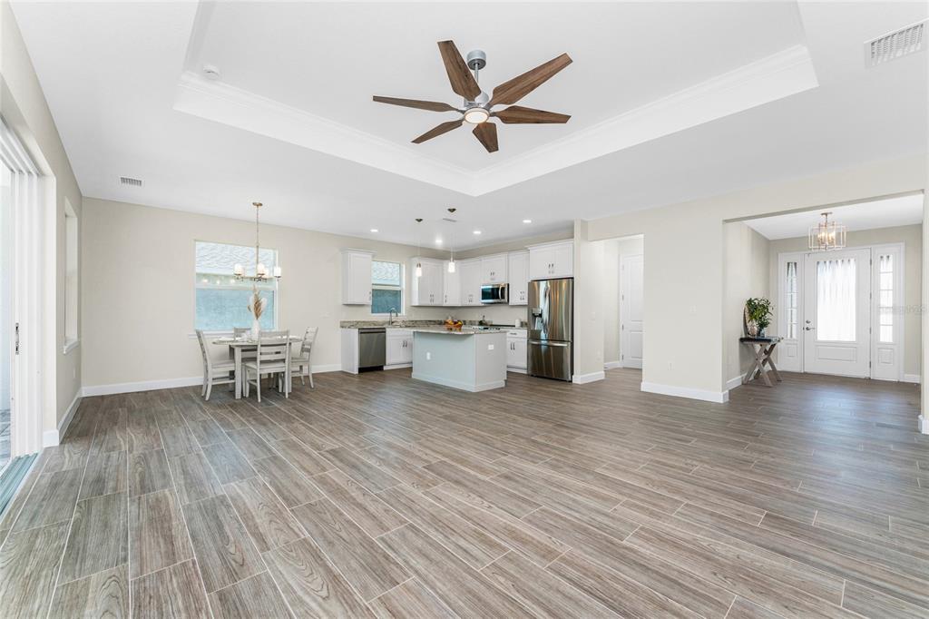 399 Sunset Road Rotonda West, FL 33947 - Photo 12 of 57 a view of a kitchen with microwave and furniture