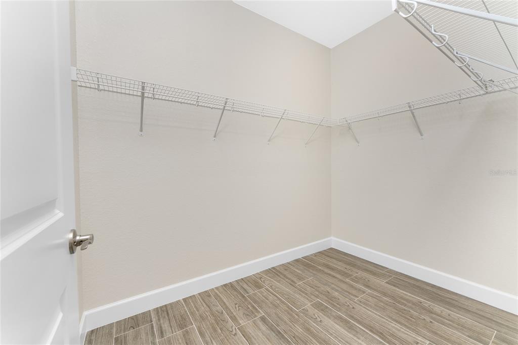 399 Sunset Road Rotonda West, FL 33947 - Photo 23 of 57 a view of a room with wooden floor