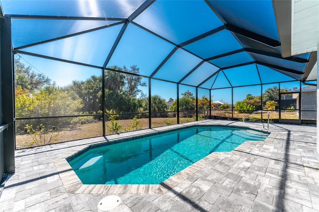 399 Sunset Road Rotonda West, FL 33947 - Photo 3 of 57 a view of a backyard with swimming pool