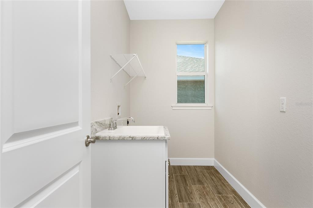 399 Sunset Road Rotonda West, FL 33947 - Photo 36 of 57 a bathroom with a sink and a mirror