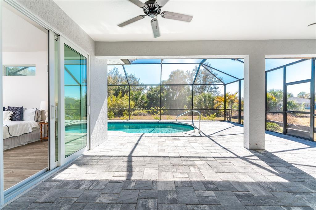 399 Sunset Road Rotonda West, FL 33947 - Photo 39 of 57 a view of an empty room with a floor to ceiling window and an outdoor space
