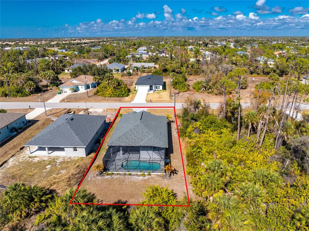 399 Sunset Road Rotonda West, FL 33947 - Photo 55 of 57 an aerial view of residential houses with outdoor space