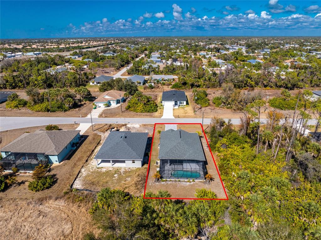 399 Sunset Road Rotonda West, FL 33947 - Photo 56 of 57 an aerial view of residential houses with outdoor space