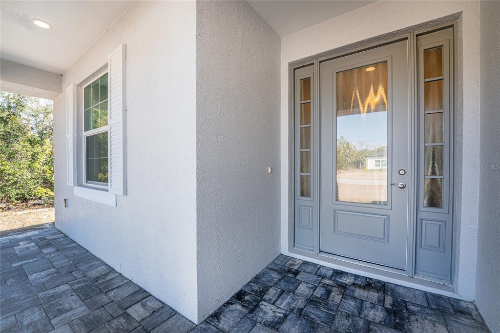 399 Sunset Road Rotonda West, FL 33947 - Photo 7 of 57 an empty room with windows and closet