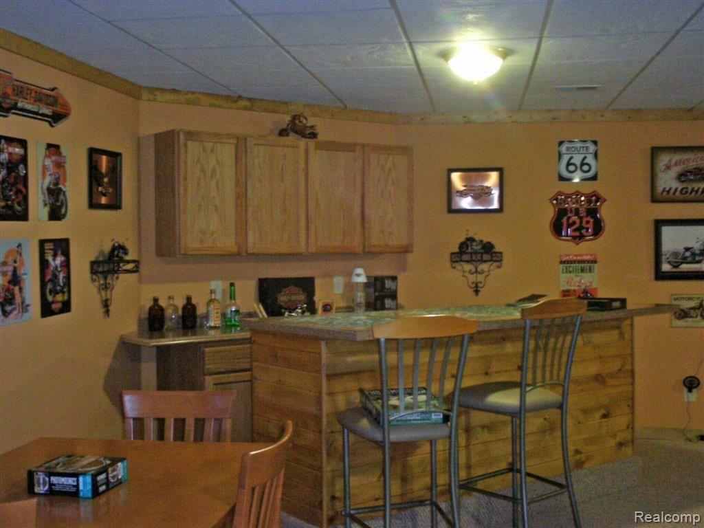 4170 Catlin Road Columbiaville, MI 48421 - Photo 14 of 25 Basement bar.JPG