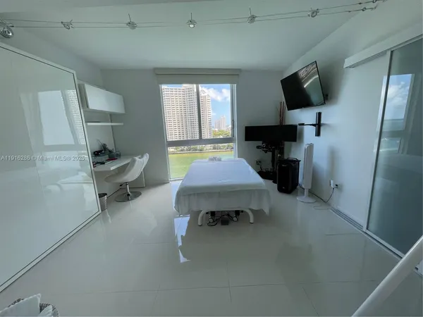 a room with furniture and a flat screen tv