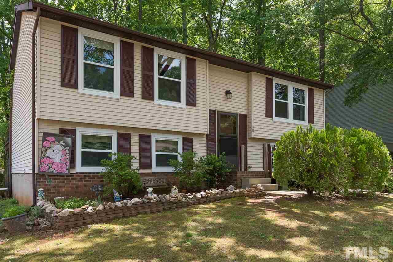 7140 Shellburne Drive Raleigh, NC 27612 - Photo 1 of 22 a front view of a house with a yard