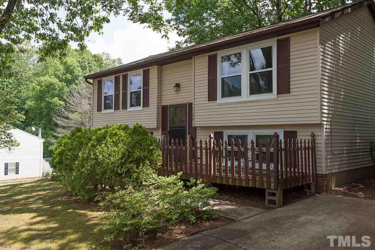 7140 Shellburne Drive Raleigh, NC 27612 - Photo 2 of 22 a front view of a house with garden