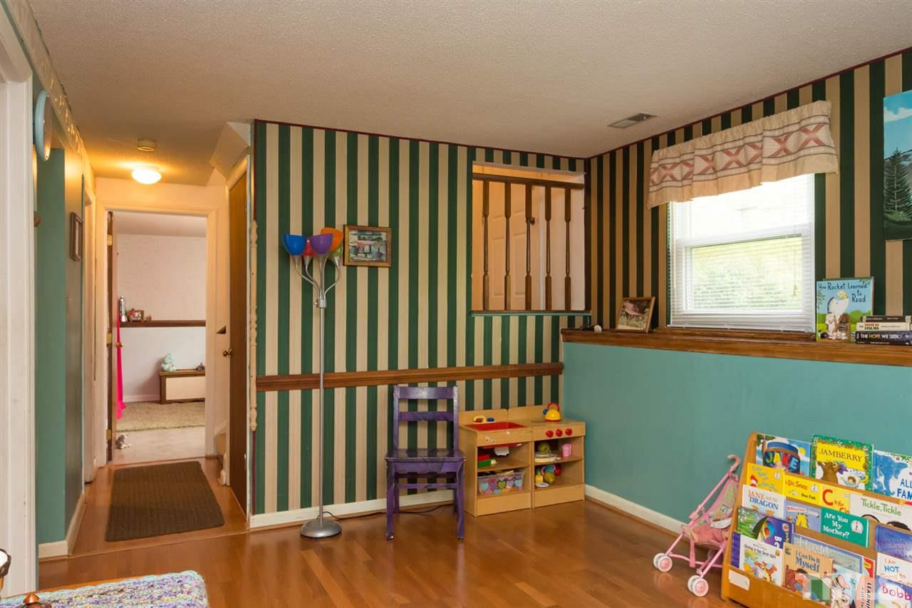 7140 Shellburne Drive Raleigh, NC 27612 - Photo 13 of 22 a bedroom with a bed and a window