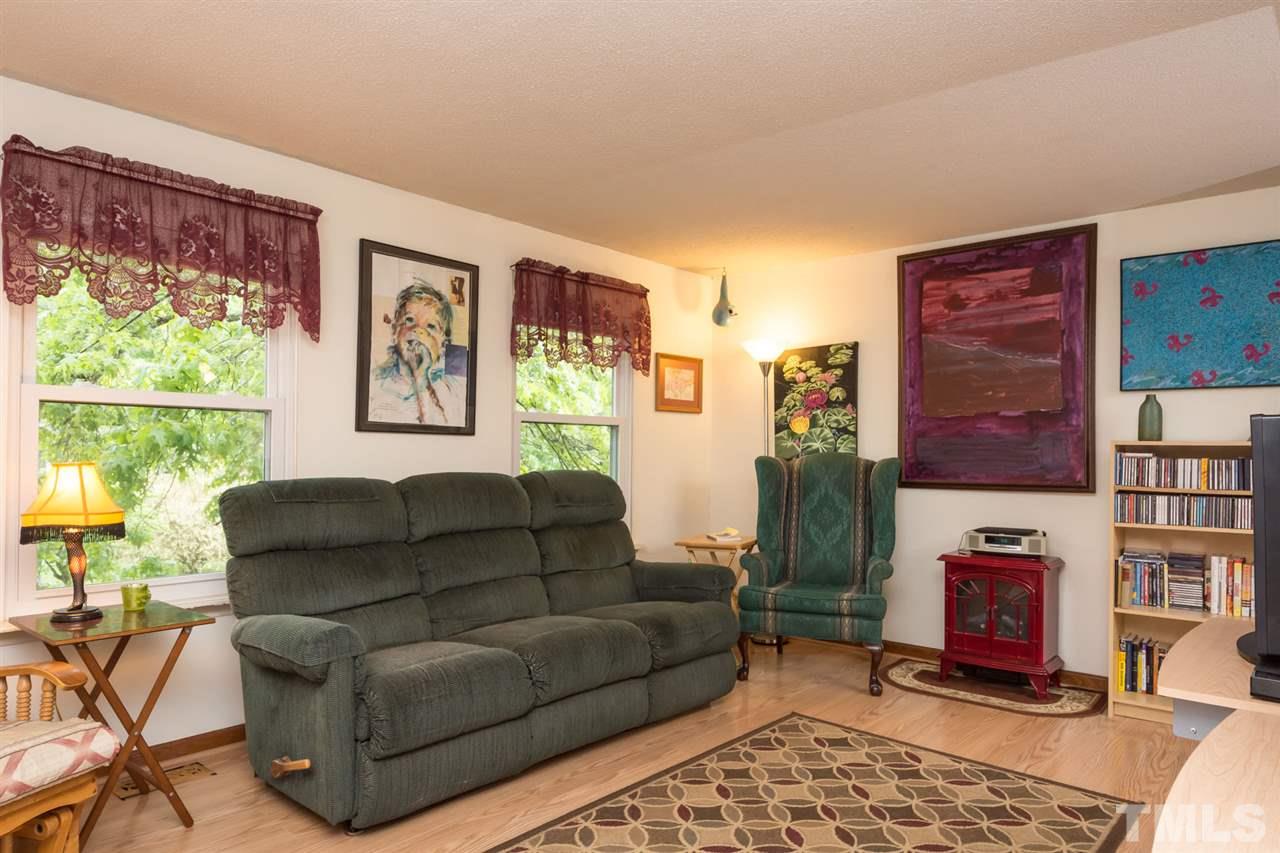 7140 Shellburne Drive Raleigh, NC 27612 - Photo 5 of 22 a living room with furniture and a window