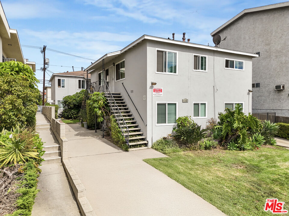 1246 South Saltair Avenue Los Angeles, CA 90025 - Photo 2 of 27 a front view of a house with garden