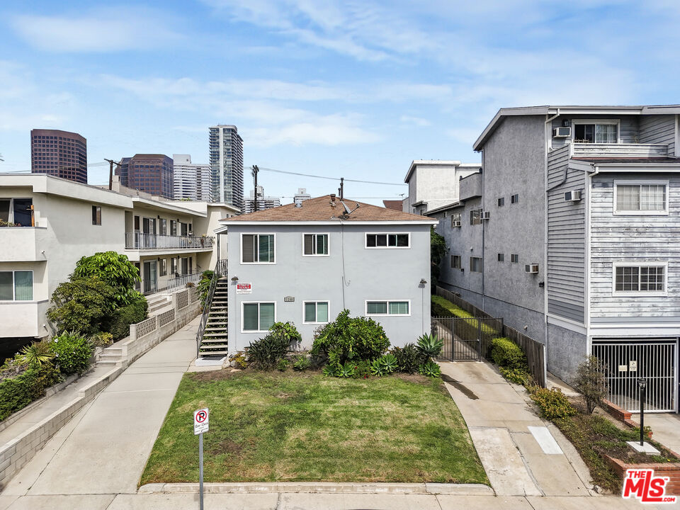 1246 South Saltair Avenue Los Angeles, CA 90025 - Photo 23 of 27 a front view of a house with garden