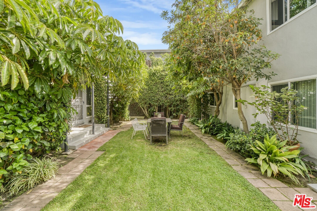 1246 South Saltair Avenue Los Angeles, CA 90025 - Photo 5 of 27 a view of a chair and table in the garden