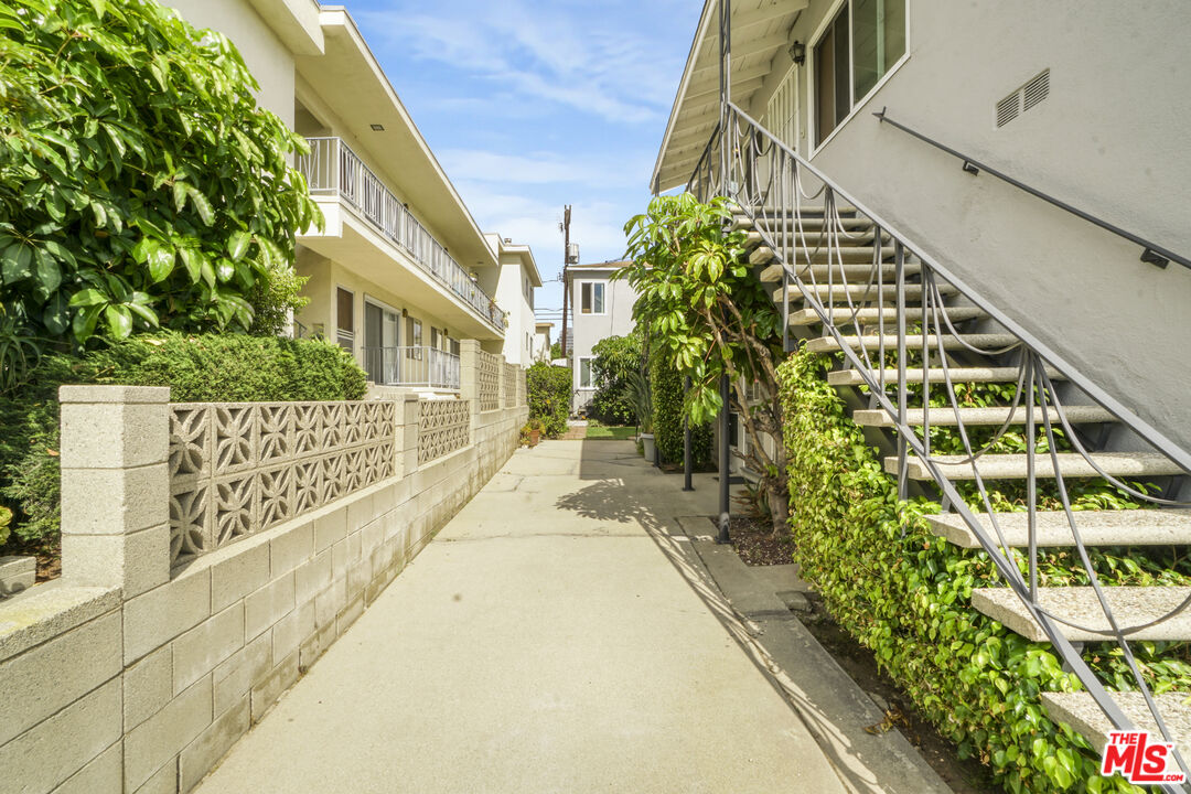 1246 South Saltair Avenue Los Angeles, CA 90025 - Photo 9 of 27 a view of a pathway of a building